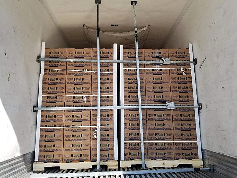 Cargo support jack load bars applied inside truck trailer for cargo load securing