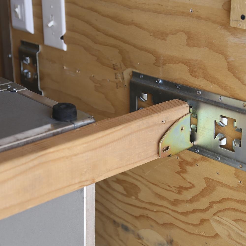 Wood beam socket track fitting for L Track cargo securing in vans and trailers
