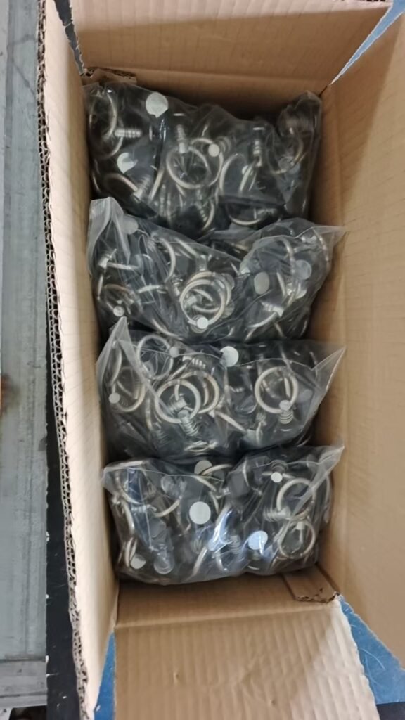 Black track fitting accessories in wooden storage box