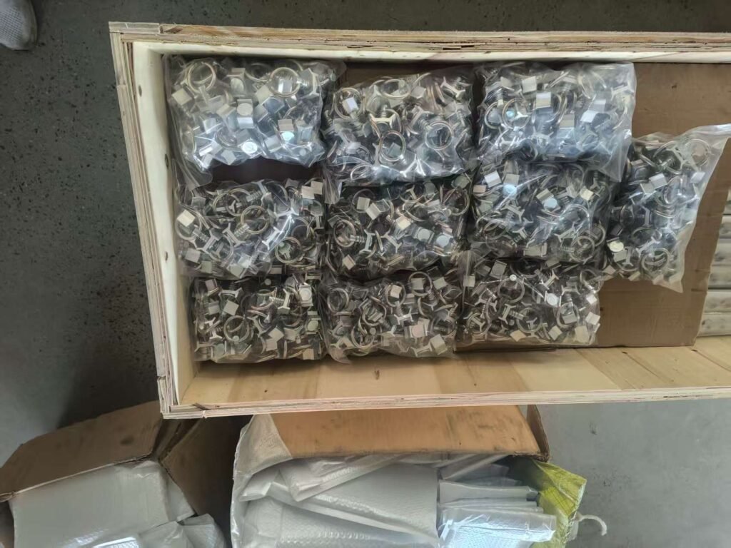 Black track fitting accessories in wooden storage box
